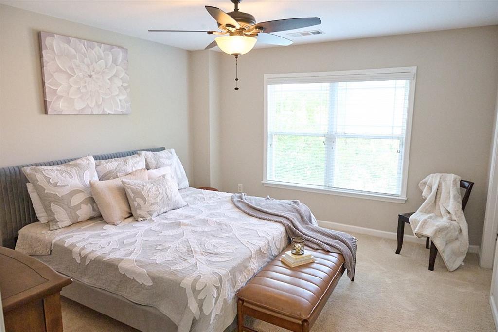 14183 Yacht Terrace Alpharetta, GA 30004 - Photo 24 of 30 a bedroom with a bed and window