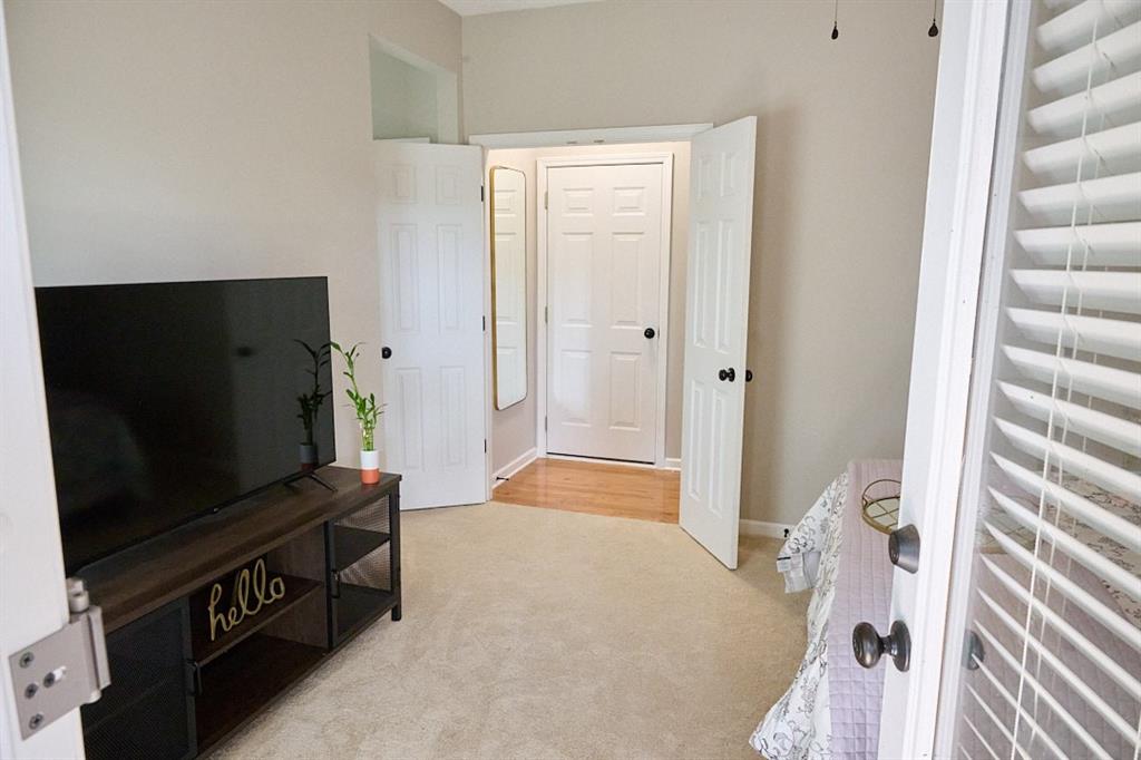 14183 Yacht Terrace Alpharetta, GA 30004 - Photo 28 of 30 a living room with furniture and a flat screen tv