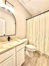 14183 Yacht Terrace Alpharetta, GA 30004 - Photo 29 of 30 a bathroom with a granite countertop sink mirror vanity and toilet