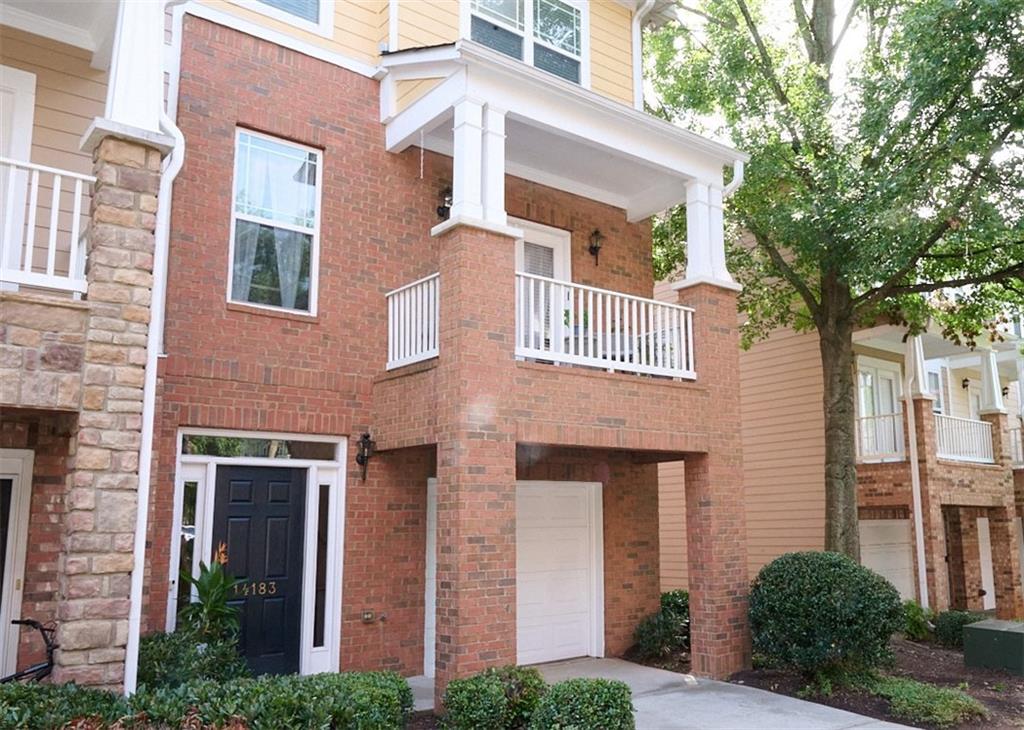 14183 Yacht Terrace Alpharetta, GA 30004 - Photo 3 of 30 front view of a brick house with a large windows