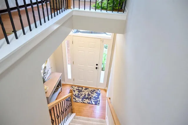 a view of an entryway with wooden floor