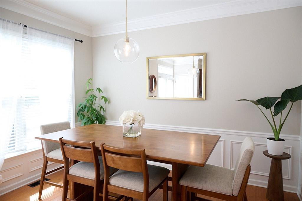 14183 Yacht Terrace Alpharetta, GA 30004 - Photo 10 of 30 a view of a dining room with furniture and wooden floor