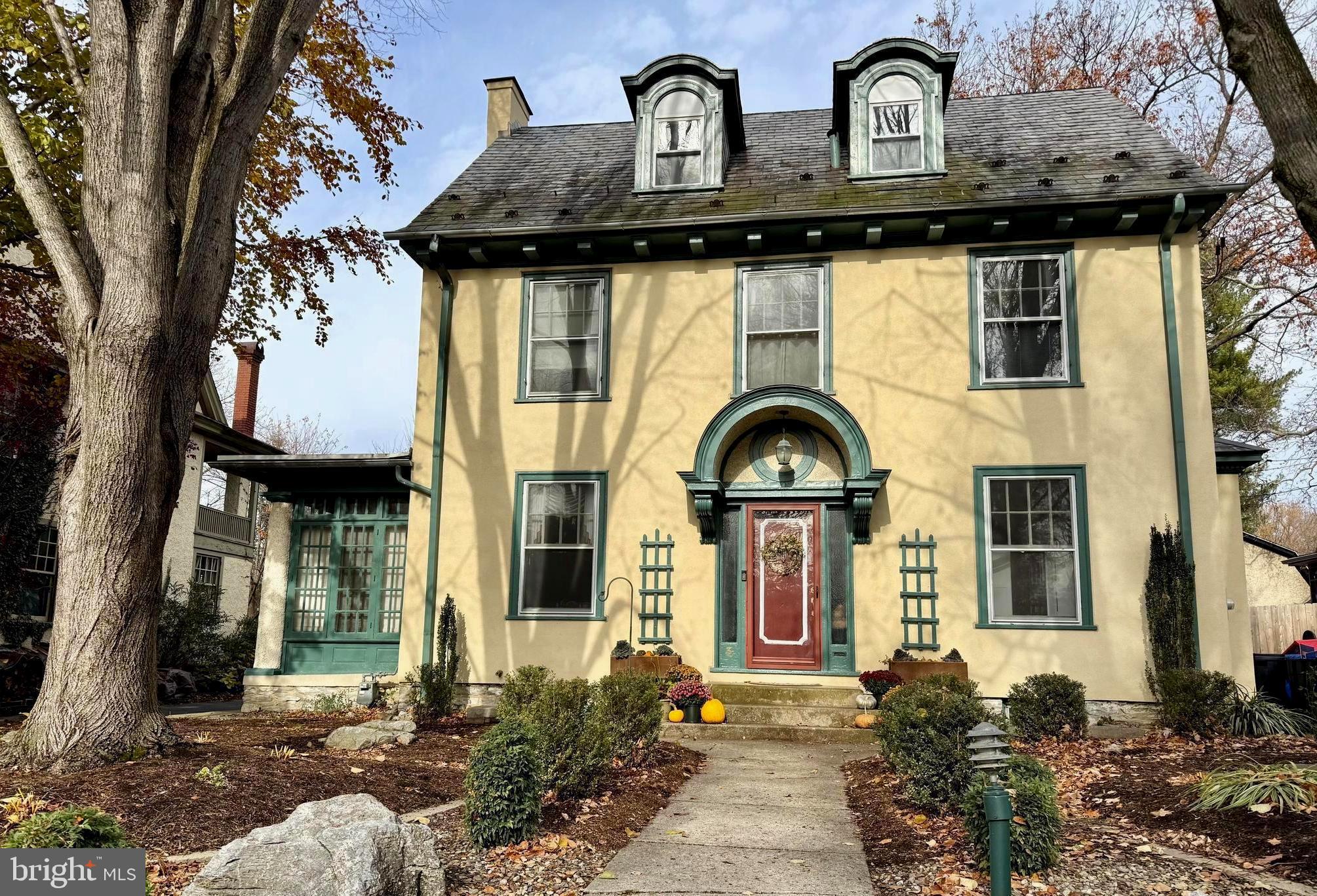a front view of a house with garden