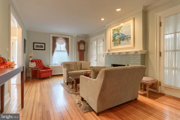 a kitchen with a table chairs and a sink