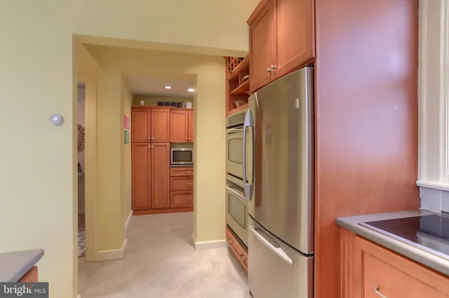 a view of a dining room with furniture and window