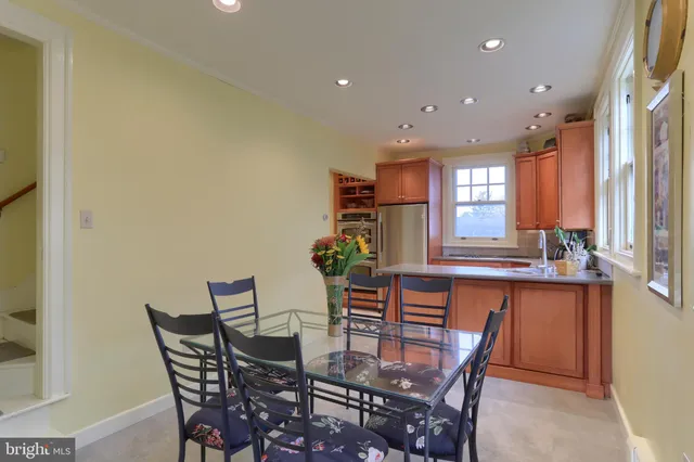 a view of a dining room with furniture and windows