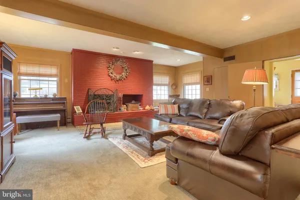 a view of room with furniture and flat screen tv