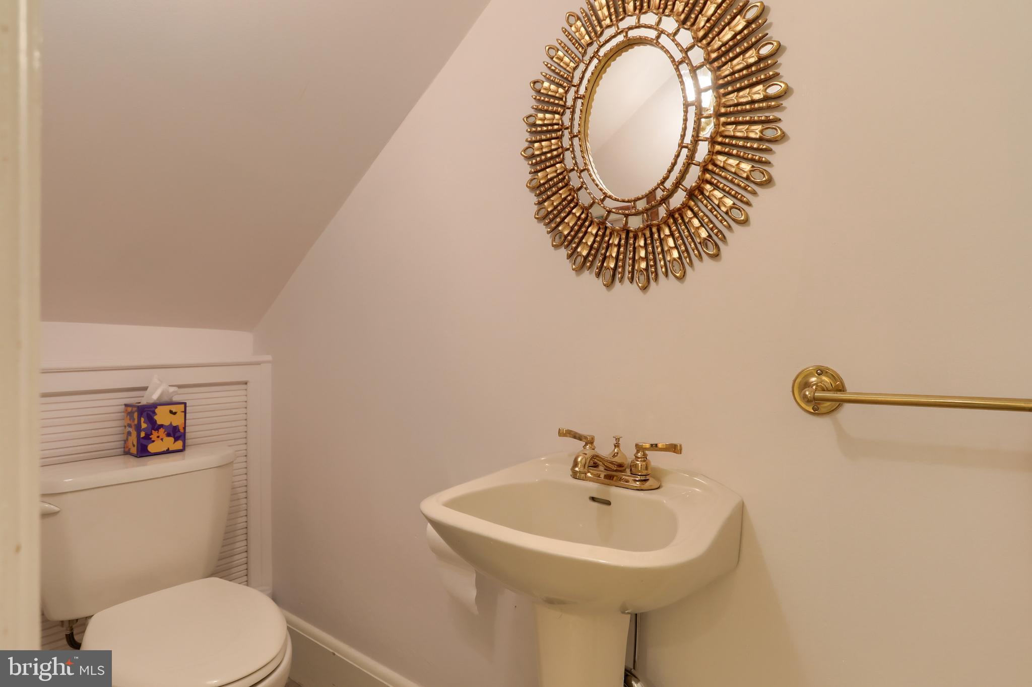 3 East High Street Lebanon, PA 17042 - Photo 28 of 55 a bathroom with a sink mirror toilet and a mirror