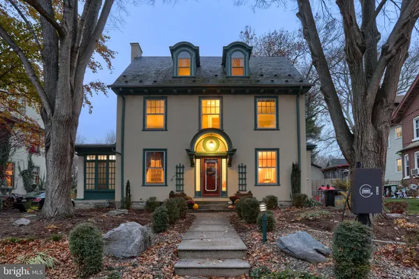 a front view of a house with garden