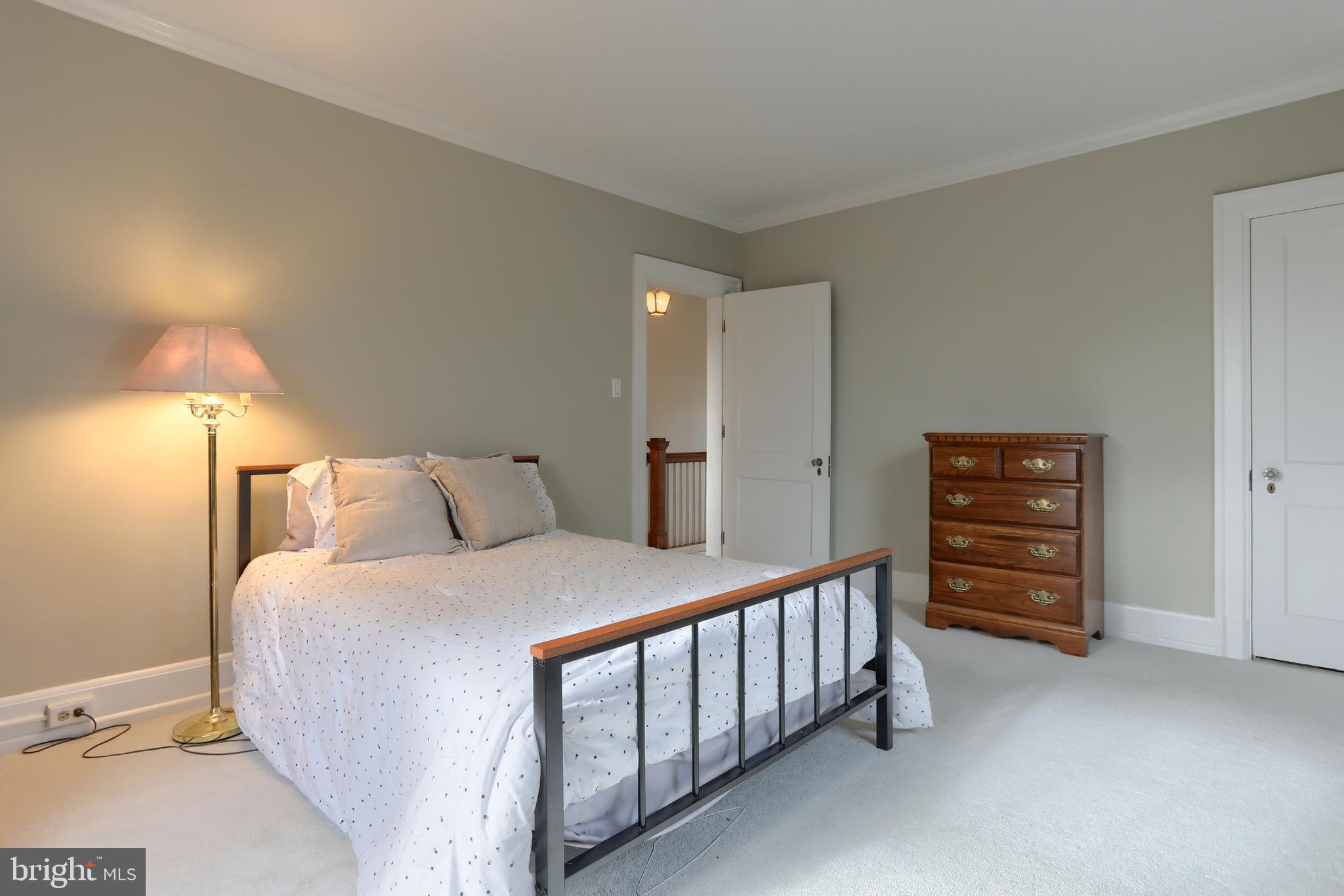 3 East High Street Lebanon, PA 17042 - Photo 34 of 55 a bedroom with a bed and a lamp on the dresser