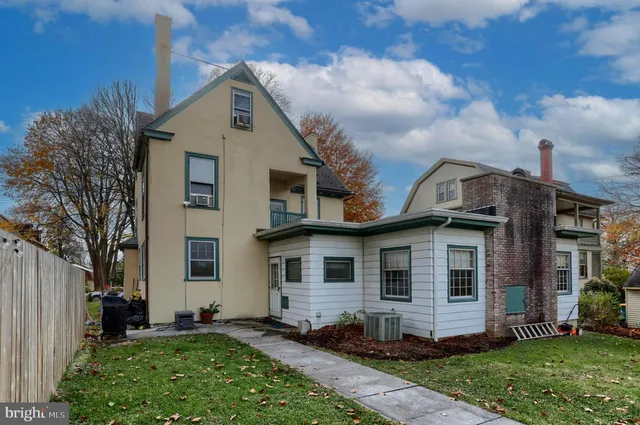 a view of a backyard with plants and a patio