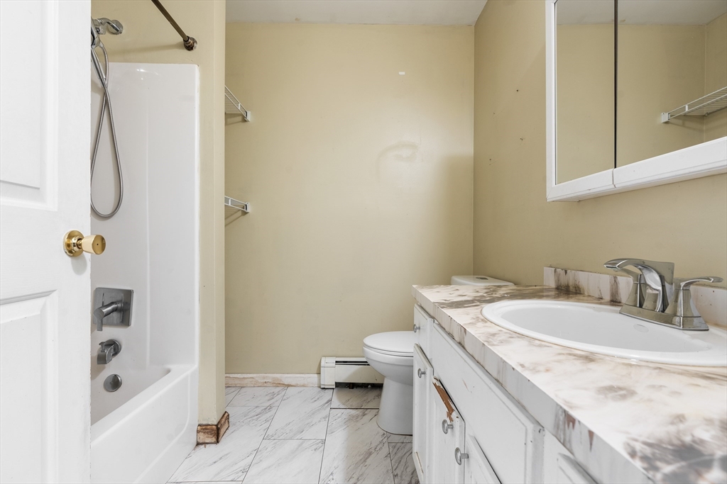 3 Meadow Lane Orange, MA 01364 - Photo 14 of 40 a bathroom with a granite countertop sink a toilet and shower