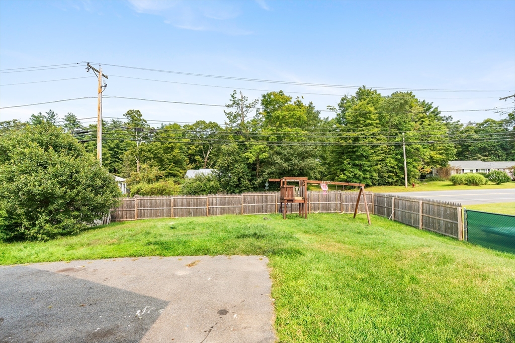 3 Meadow Lane Orange, MA 01364 - Photo 31 of 40 a house view with a sitting space and wooden fence