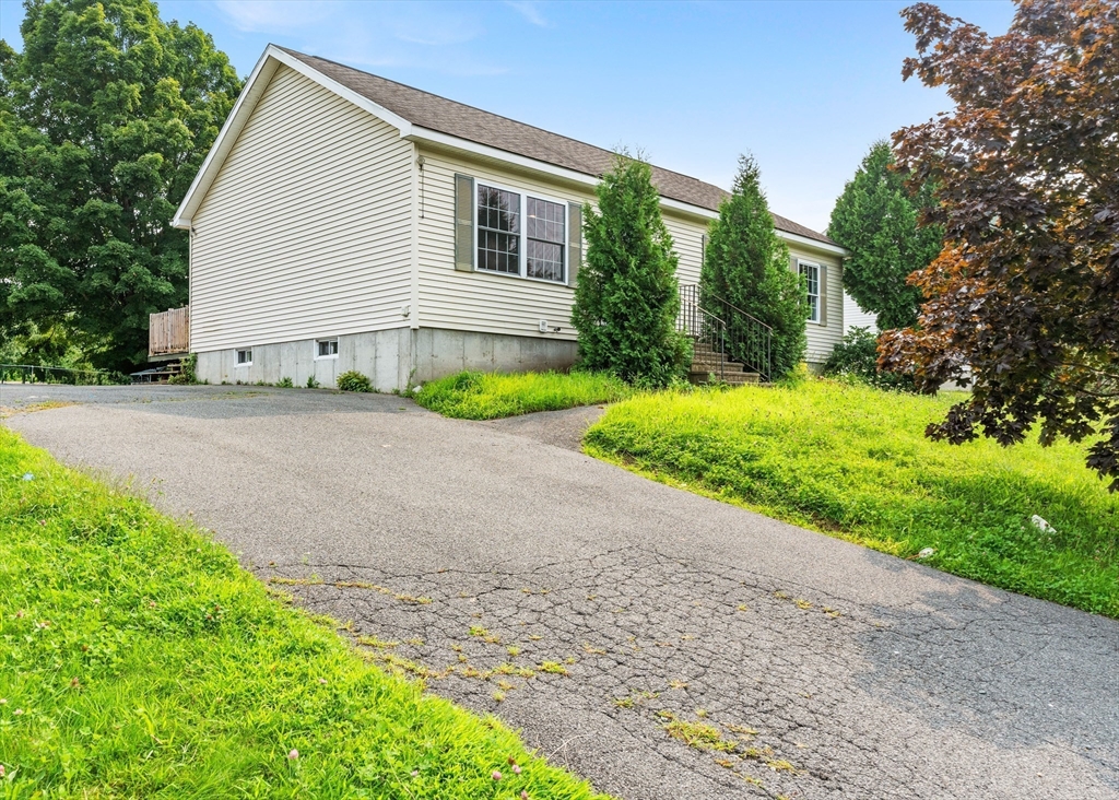 3 Meadow Lane Orange, MA 01364 - Photo 36 of 40 a view of backyard with potted plants and a bench