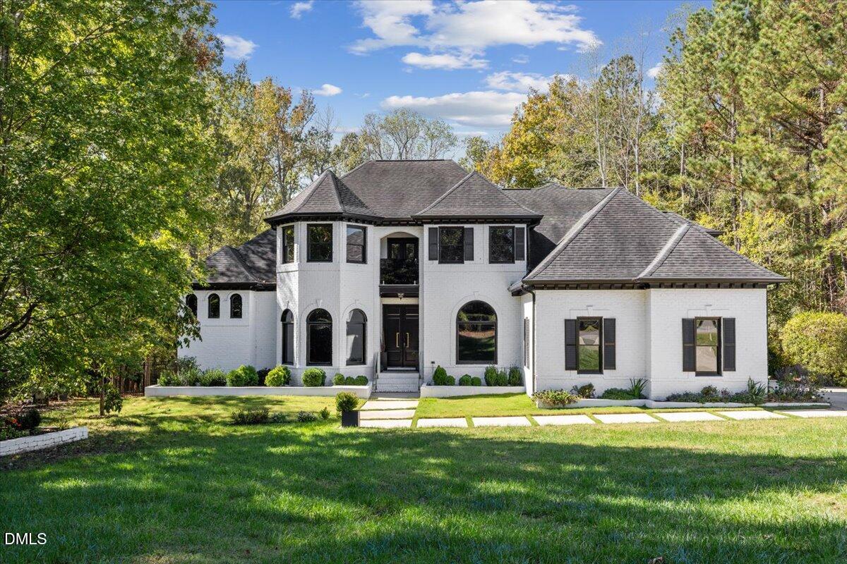 a front view of a house with a yard