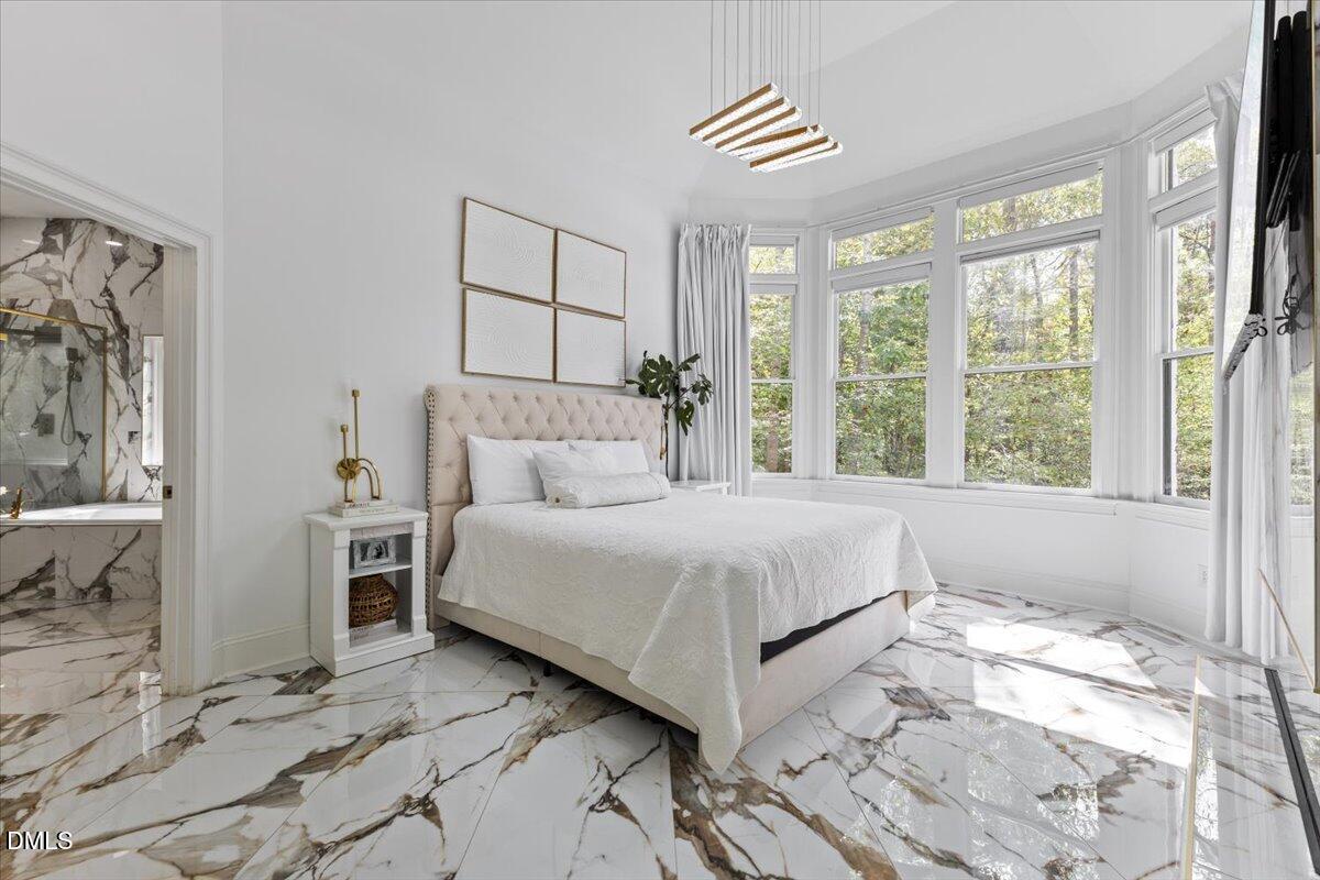 32 Woodgate Court Durham, NC 27713 - Photo 11 of 47 a bedroom with a large bed and a window