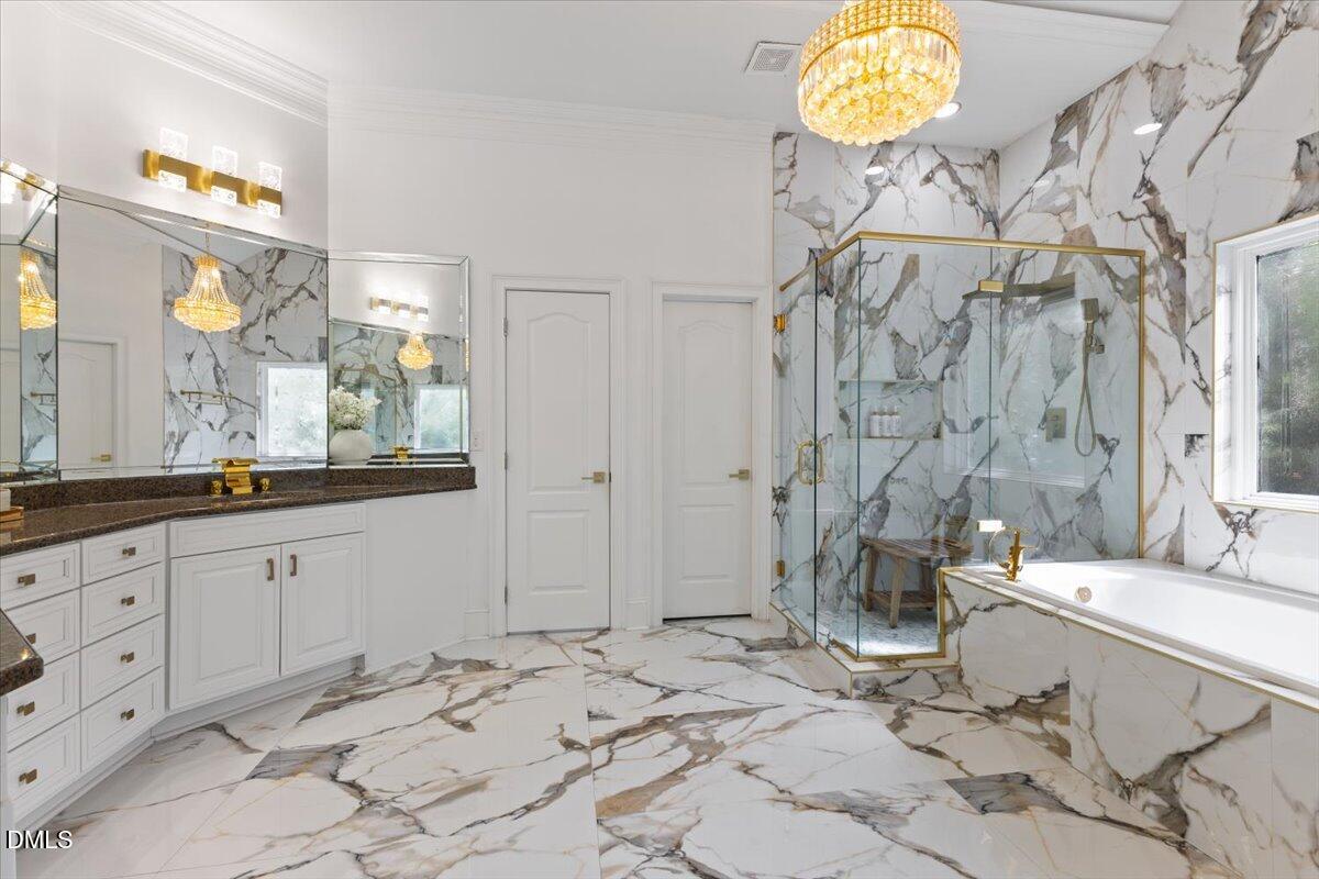 32 Woodgate Court Durham, NC 27713 - Photo 12 of 47 a bathroom with double vanity sink and a mirror