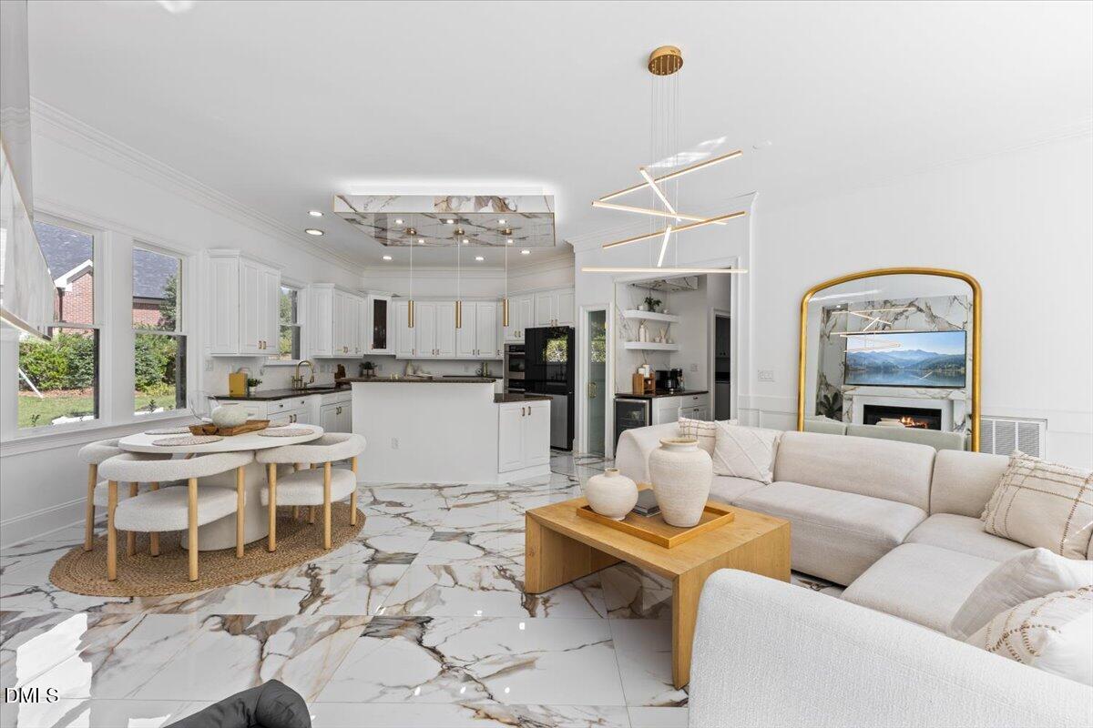 32 Woodgate Court Durham, NC 27713 - Photo 19 of 47 a living room with lots of furniture and kitchen view