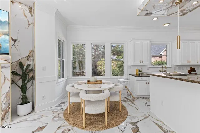 a kitchen with a stove a sink and cabinets