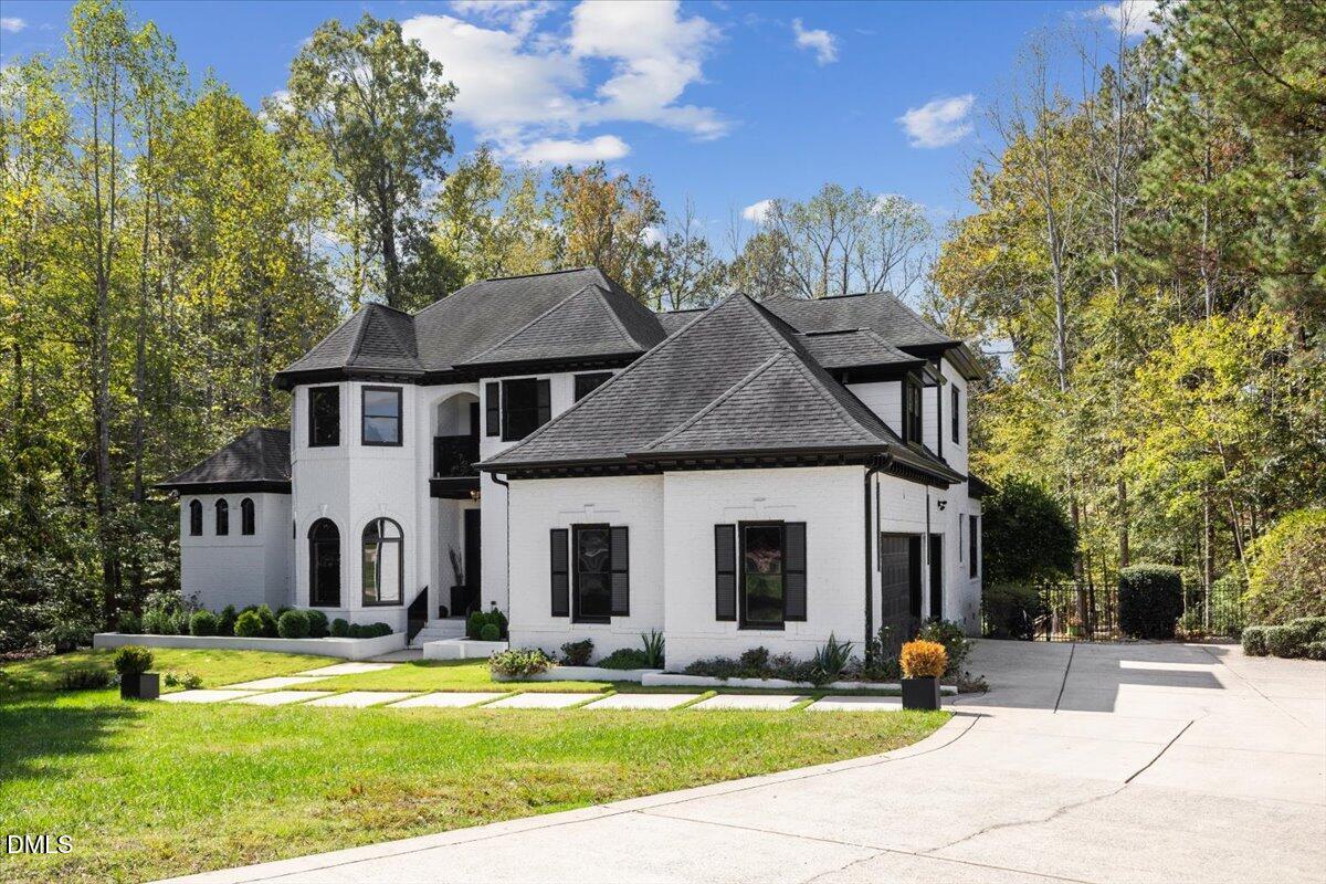32 Woodgate Court Durham, NC 27713 - Photo 2 of 47 a view of a house with swimming pool and sitting area