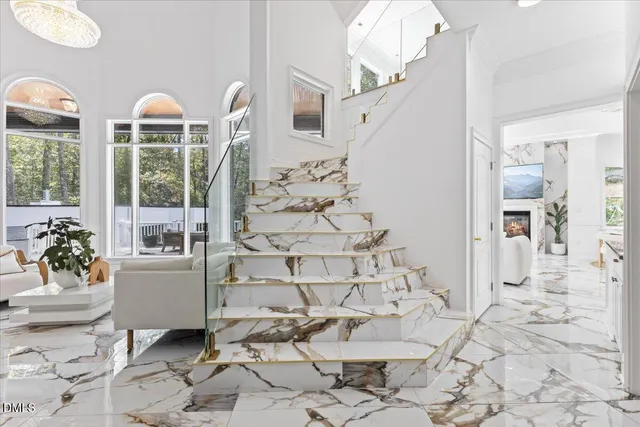 a view of a living room and a floor to ceiling window