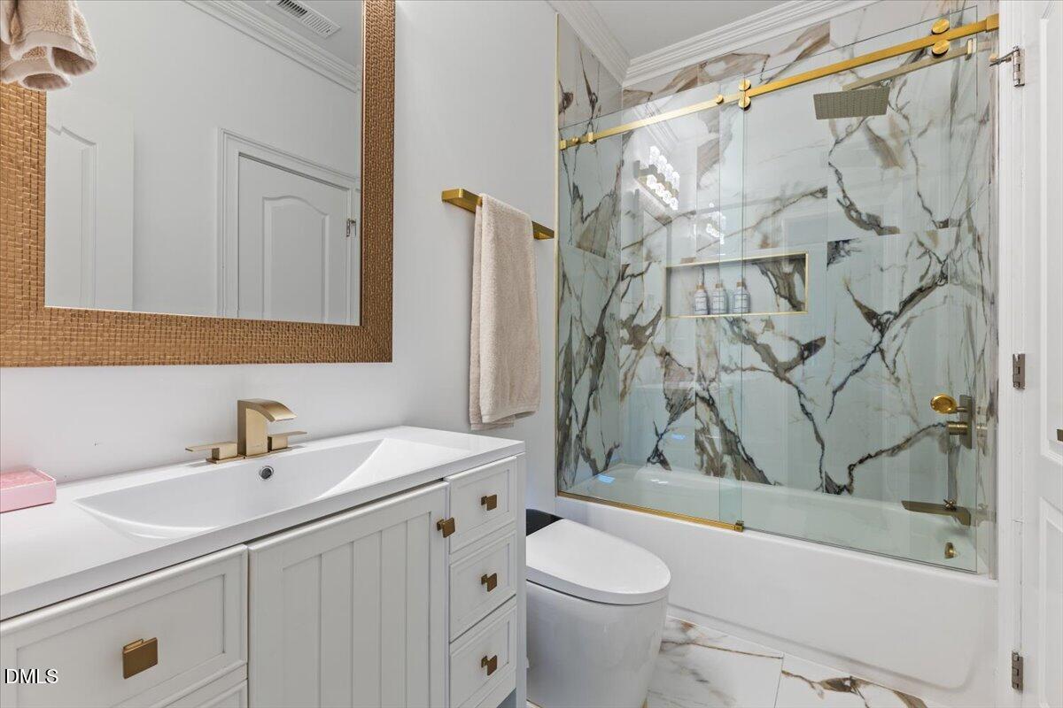 32 Woodgate Court Durham, NC 27713 - Photo 32 of 47 a bathroom with a sink toilet and shower