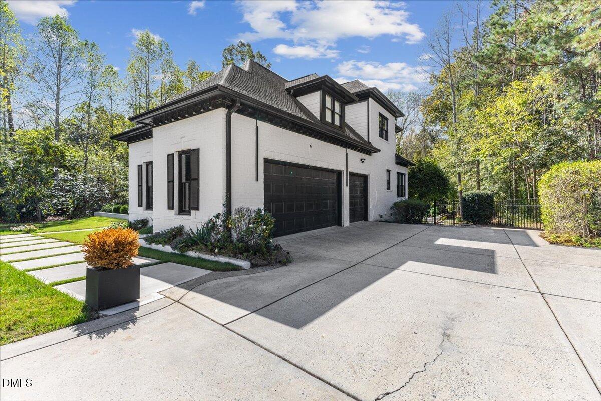 32 Woodgate Court Durham, NC 27713 - Photo 33 of 47 a view of a house with brick walls and a yard