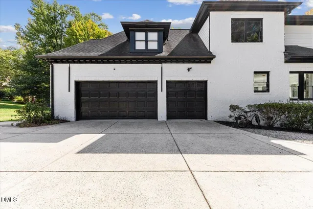 a front view of a house with a garage