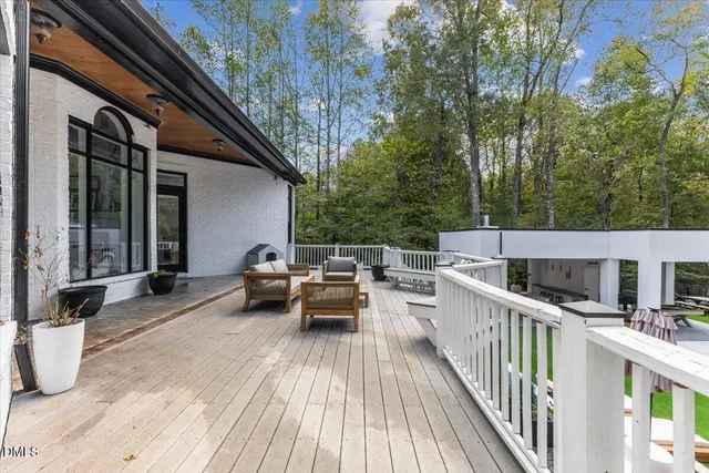 a view of a patio with a table and chairs