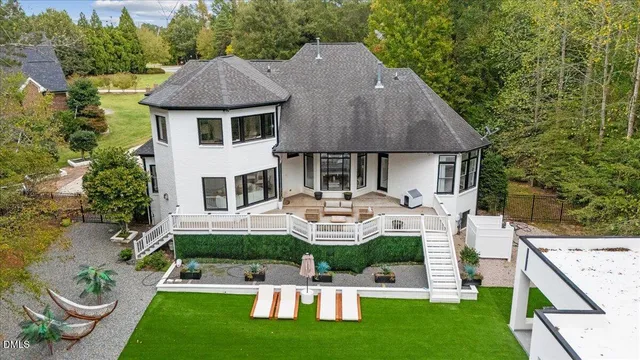 a front view of house with yard and outdoor seating
