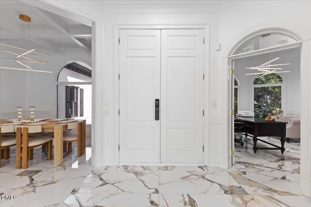 a view of a hallway with seating area