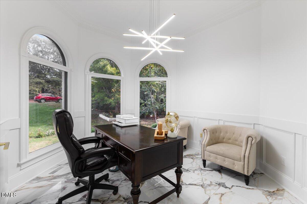 32 Woodgate Court Durham, NC 27713 - Photo 9 of 47 a dining room with furniture a chandelier and a rug