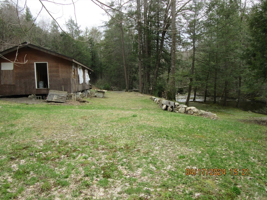 86 Ashfield Road Williamsburg, MA 01096 - Photo 11 of 20 a view of a house with backyard and sitting area