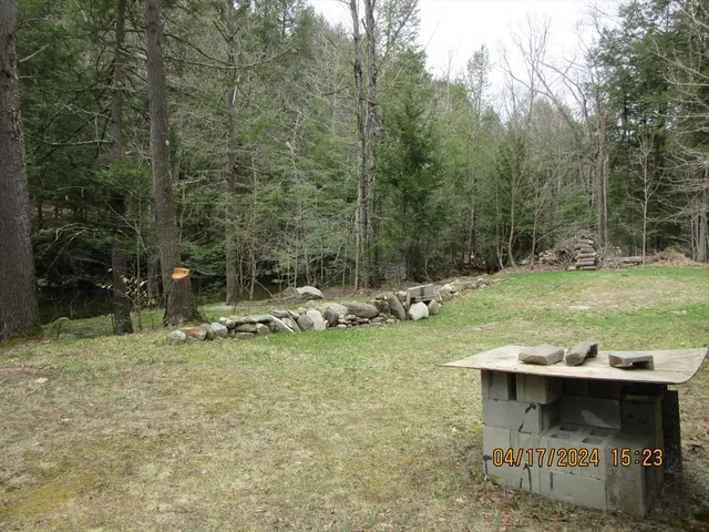 a view of a backyard with sitting area