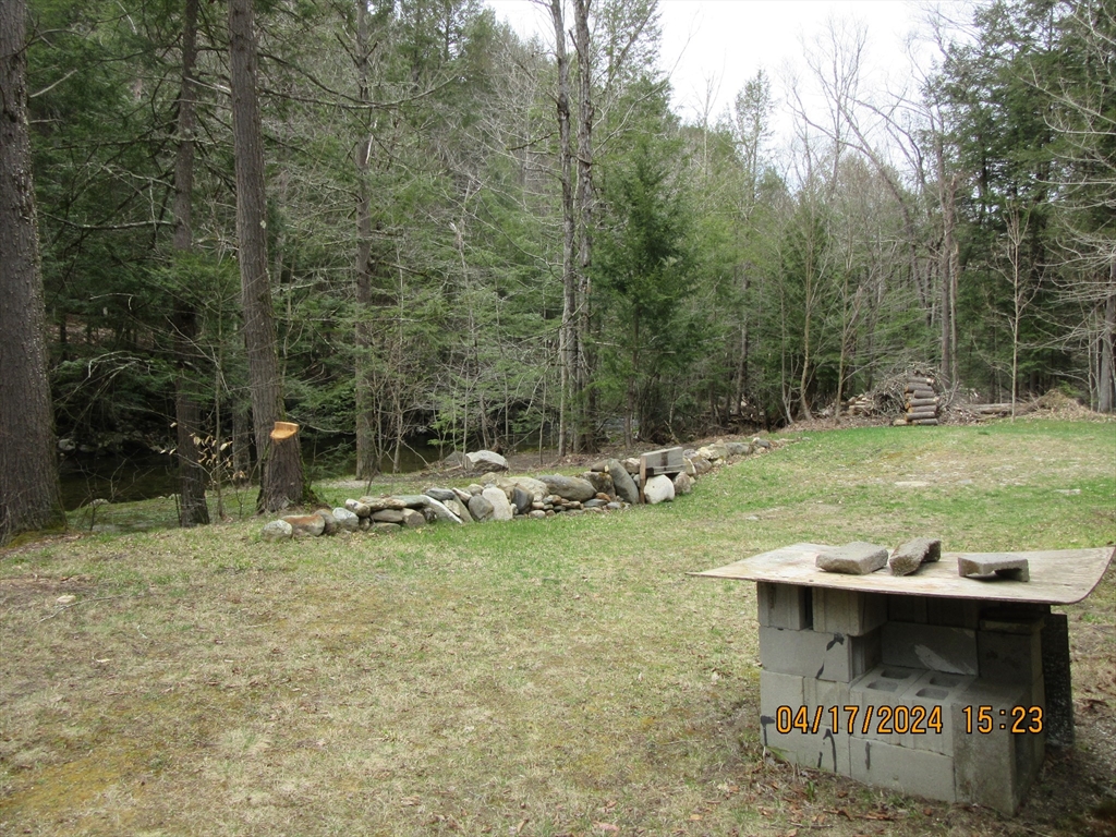 86 Ashfield Road Williamsburg, MA 01096 - Photo 8 of 20 a view of a swimming pool with a patio and a yard