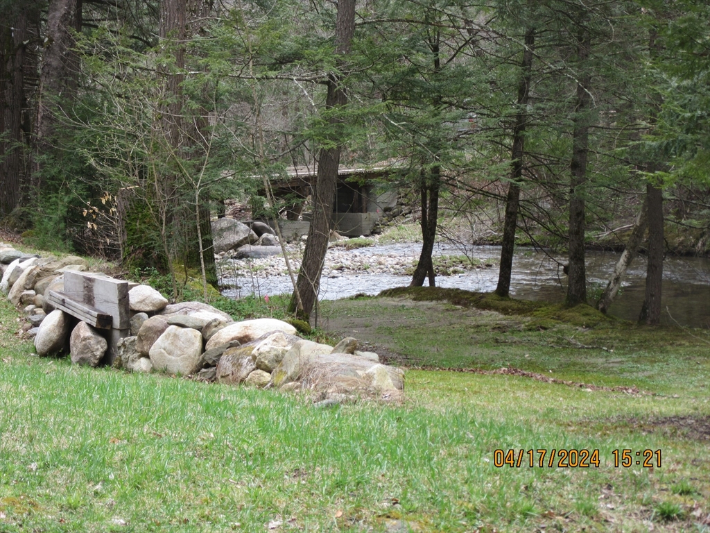 86 Ashfield Road Williamsburg, MA 01096 - Photo 10 of 20 a view of a backyard with sitting area