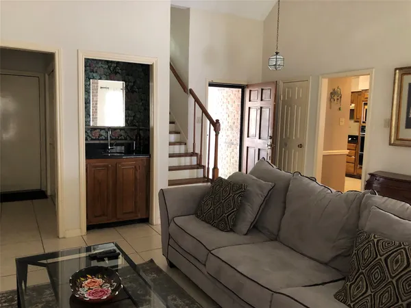 a living room with furniture and a window