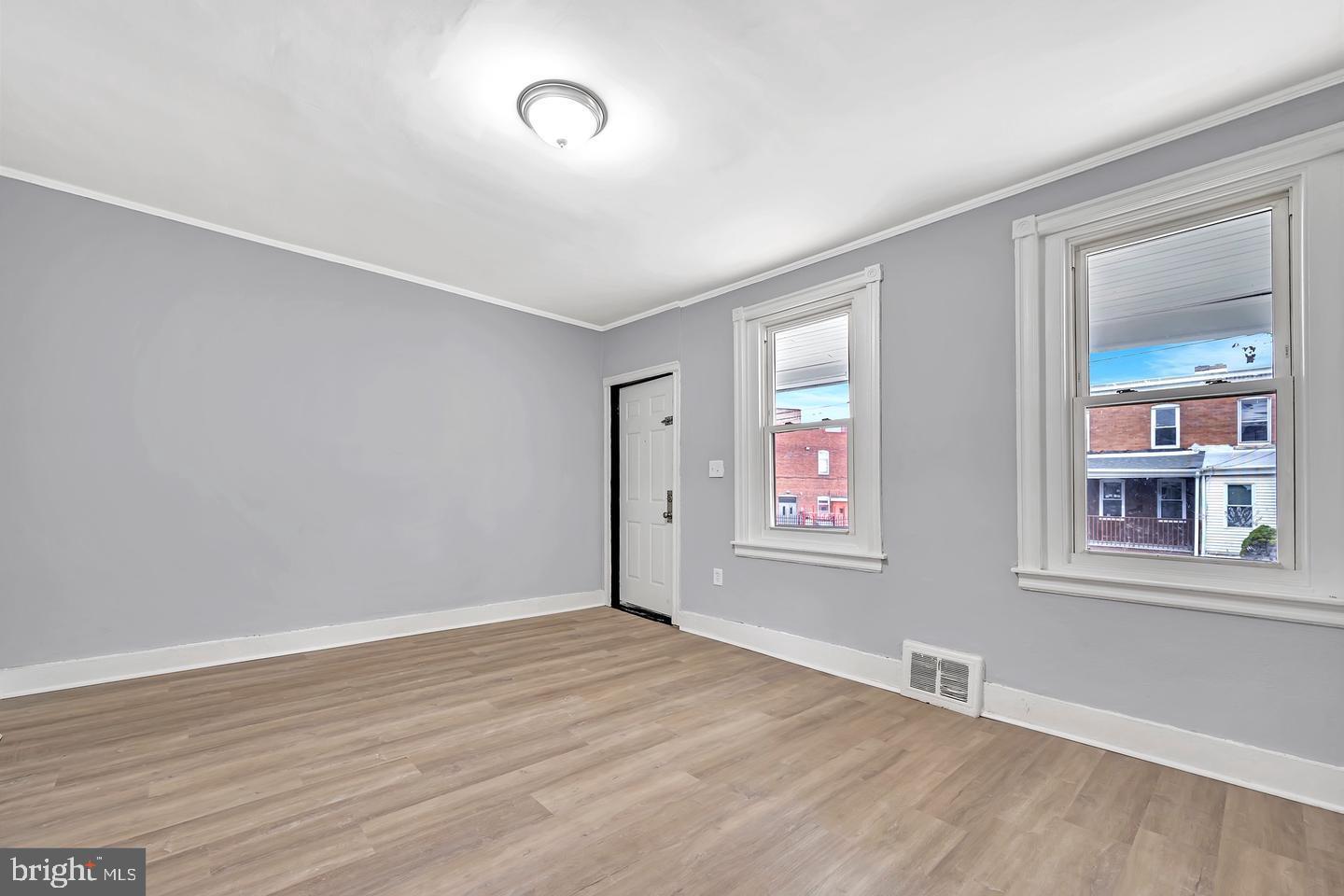 12 Adella Avenue Hamilton, NJ 08609 - Photo 13 of 27 an empty room with wooden floor and windows