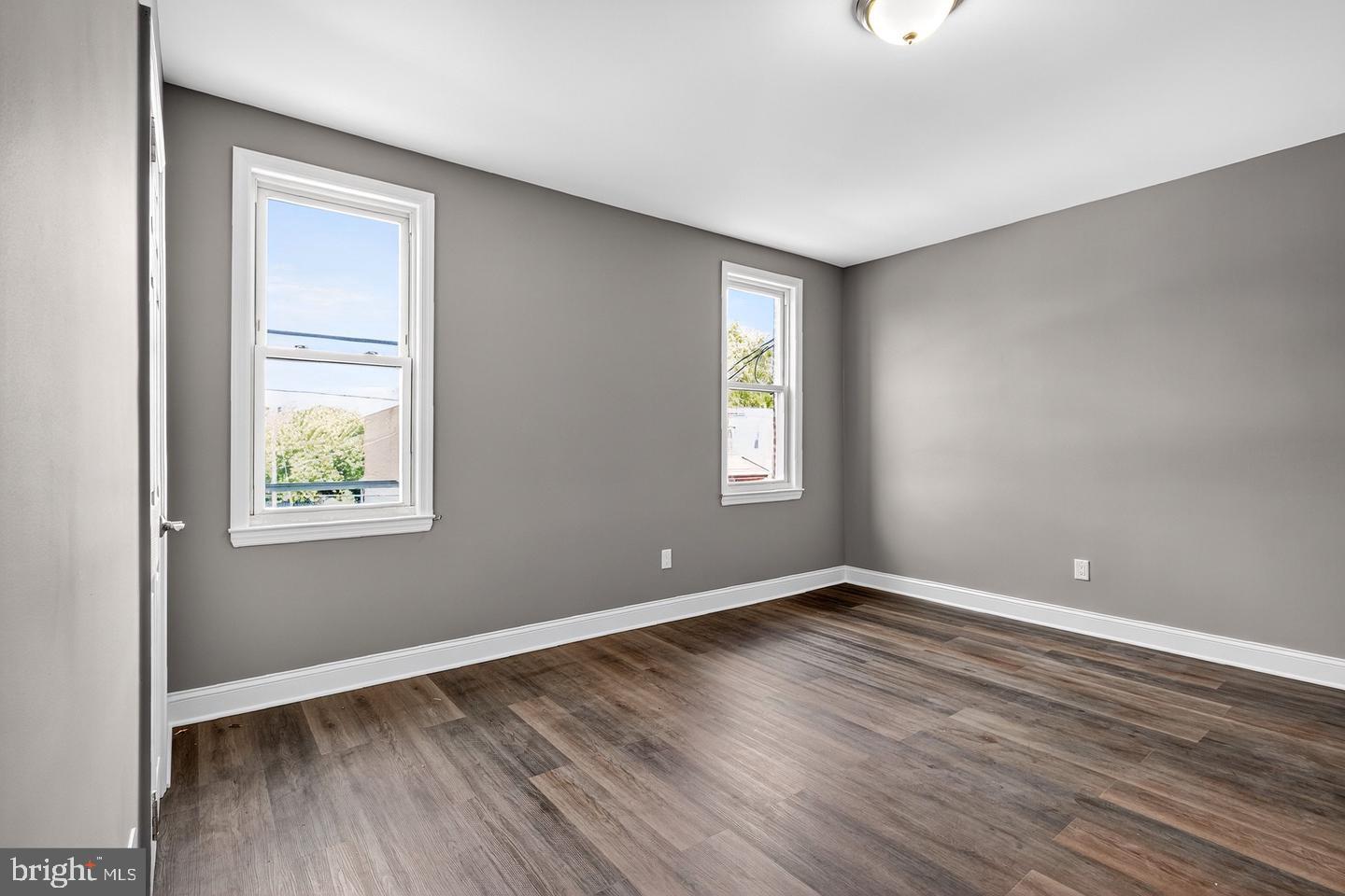 12 Adella Avenue Hamilton, NJ 08609 - Photo 20 of 27 a view of an empty room with window and wooden floor