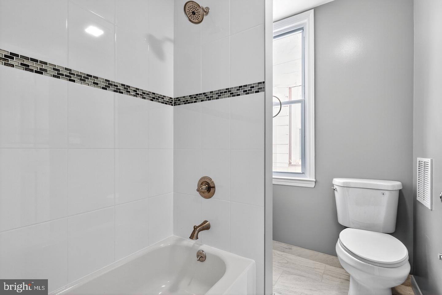 12 Adella Avenue Hamilton, NJ 08609 - Photo 22 of 27 a bathroom with a toilet a sink and a bathtub