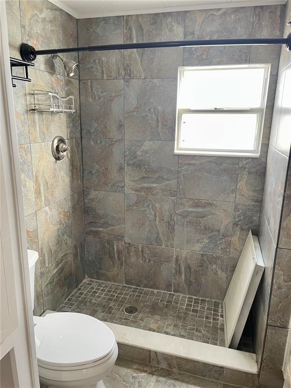 Undisclosed Address Longboat Key, FL 34228 - Photo 12 of 24 a bathroom with a toilet and a shower
