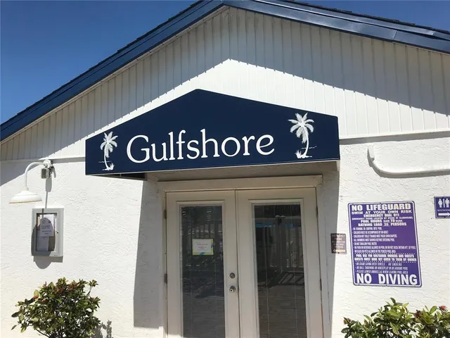 a backyard of a house with a garden and plants