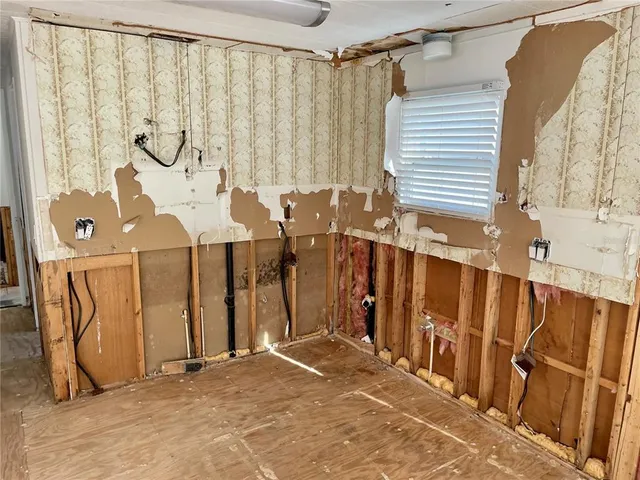 a view of a room that has a large window