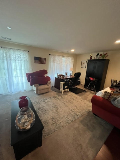 2212 Rising Hill Road Whitehall, PA 18052 - Photo 19 of 21 The living area offers a warm and inviting atmosphere, ideal for relaxation or a home office setup.