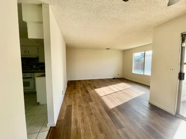 a kitchen with a stove a sink and a refrigerator