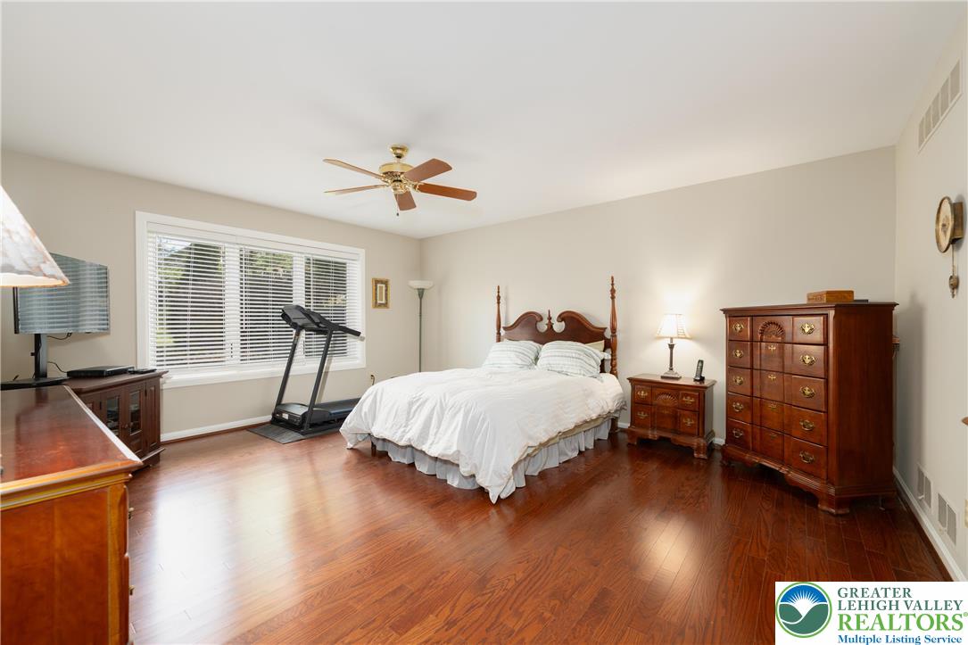 2951 Exeter Drive Emmaus, PA 18049 - Photo 25 of 44 a spacious bedroom with a bed and wooden floor
