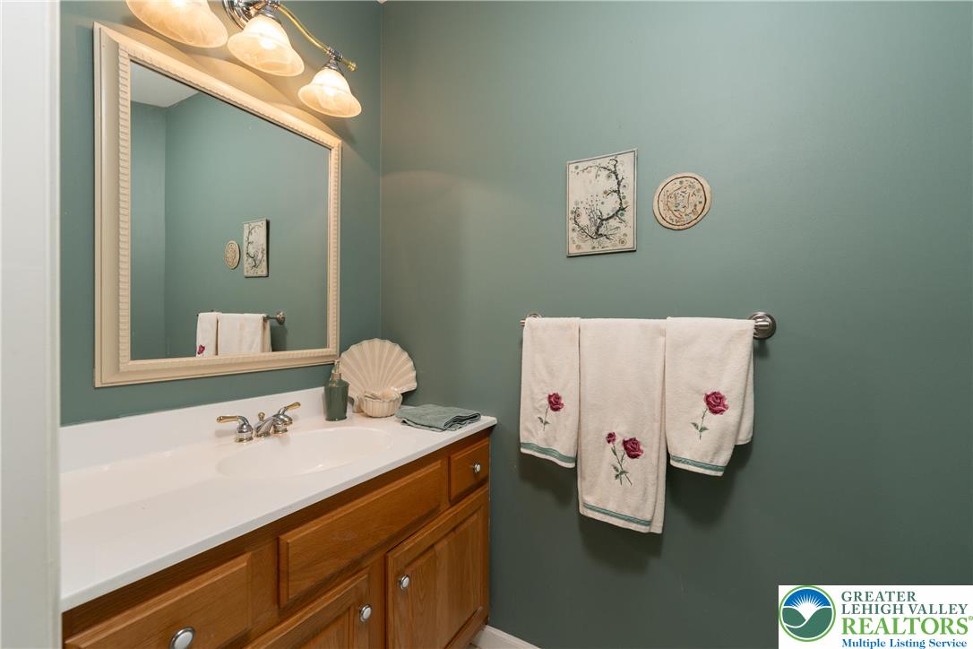 2951 Exeter Drive Emmaus, PA 18049 - Photo 30 of 44 a bathroom with a sink and a mirror