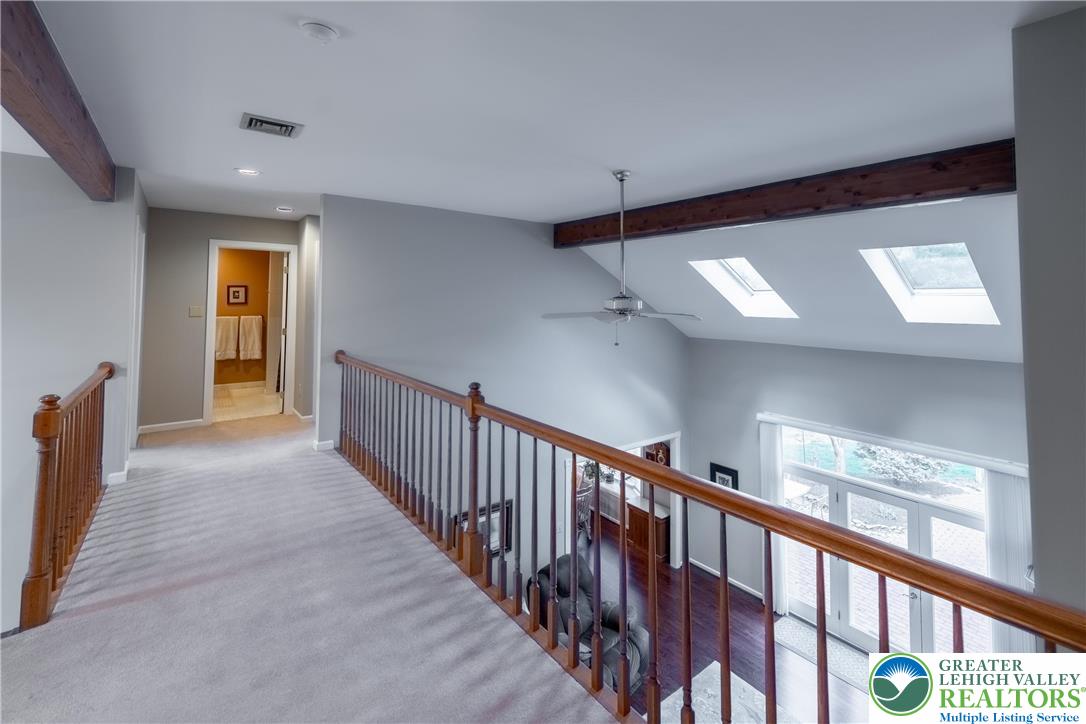 2951 Exeter Drive Emmaus, PA 18049 - Photo 38 of 44 a view of a hallway with wooden floor and staircase