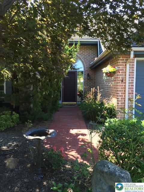 2951 Exeter Drive Emmaus, PA 18049 - Photo 40 of 44 a front view of a house with a yard and garage