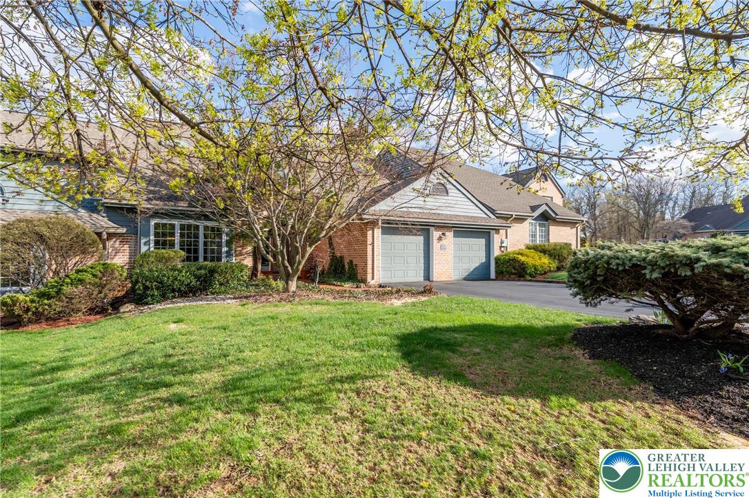 2951 Exeter Drive Emmaus, PA 18049 - Photo 5 of 44 a front view of a house with a yard